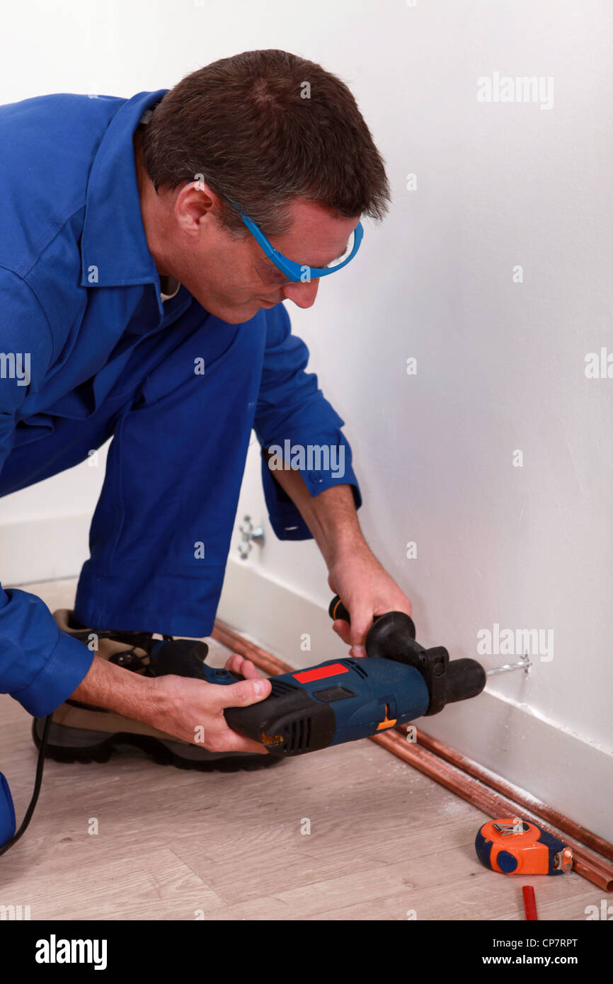 craftsman making a hole with a power drill Stock Photo Alamy
