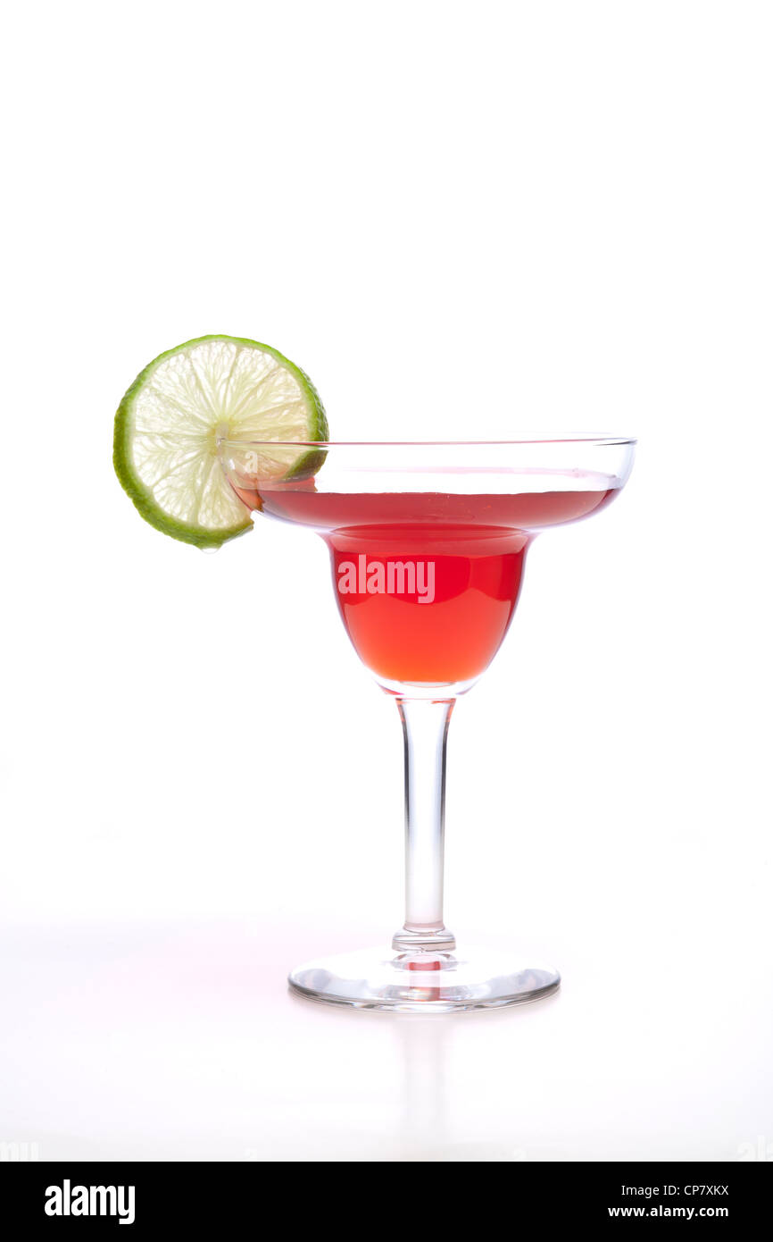 Lime garnish and red drink. Stock Photo