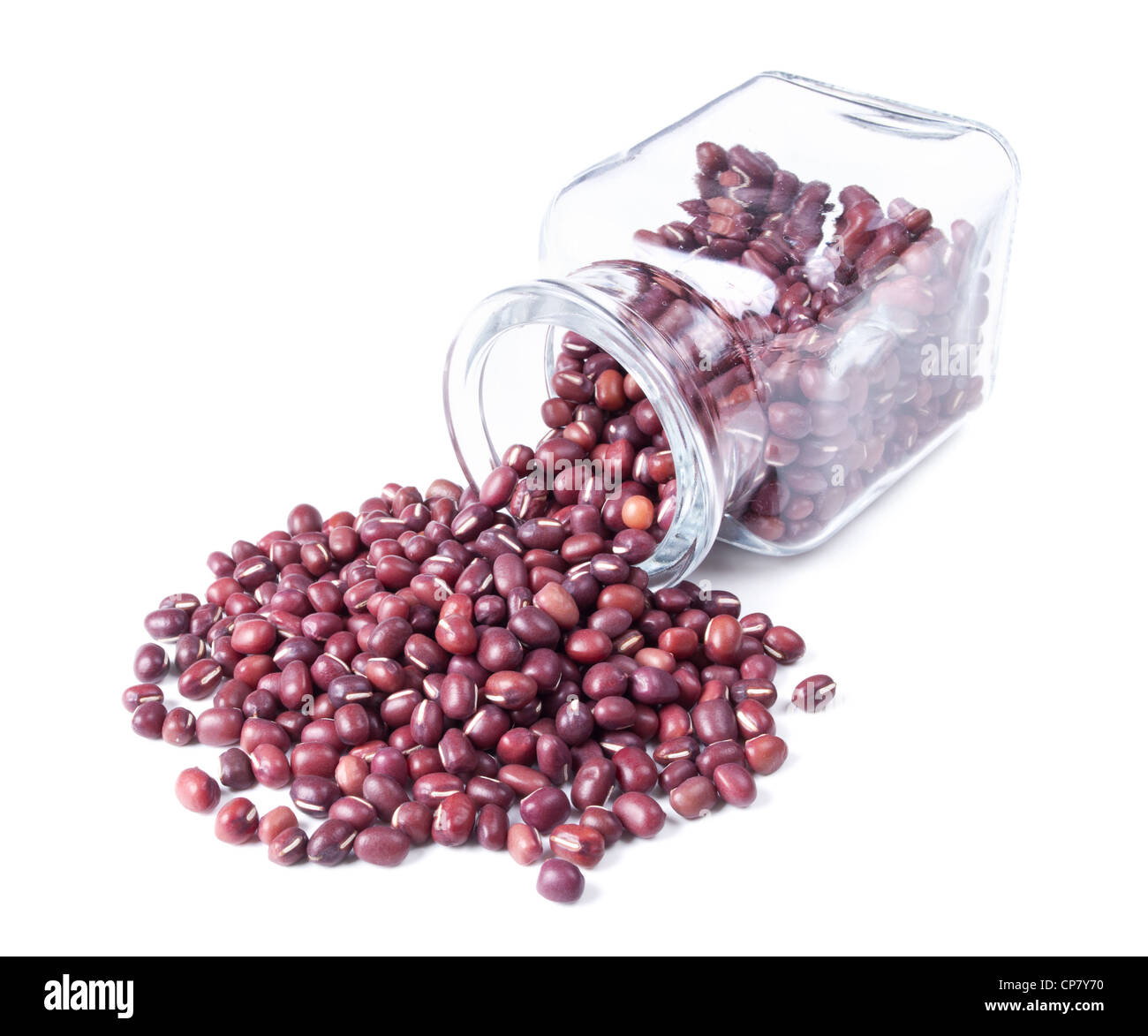 adzuki beans scattered on a white background from glass jar Stock Photo