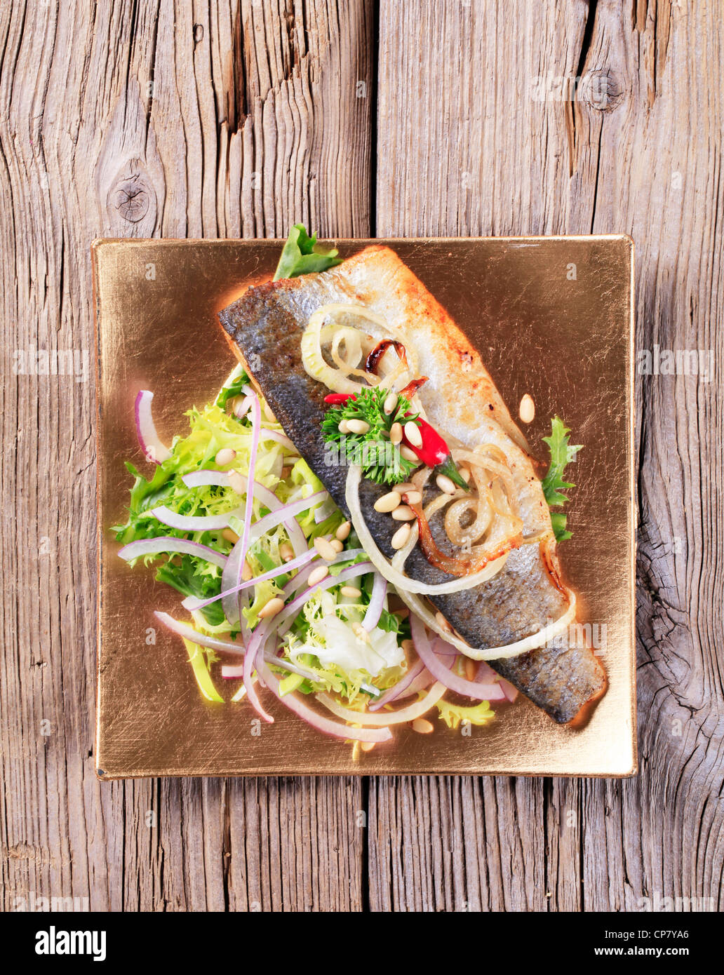 Pan fried trout fillet and green salad Stock Photo