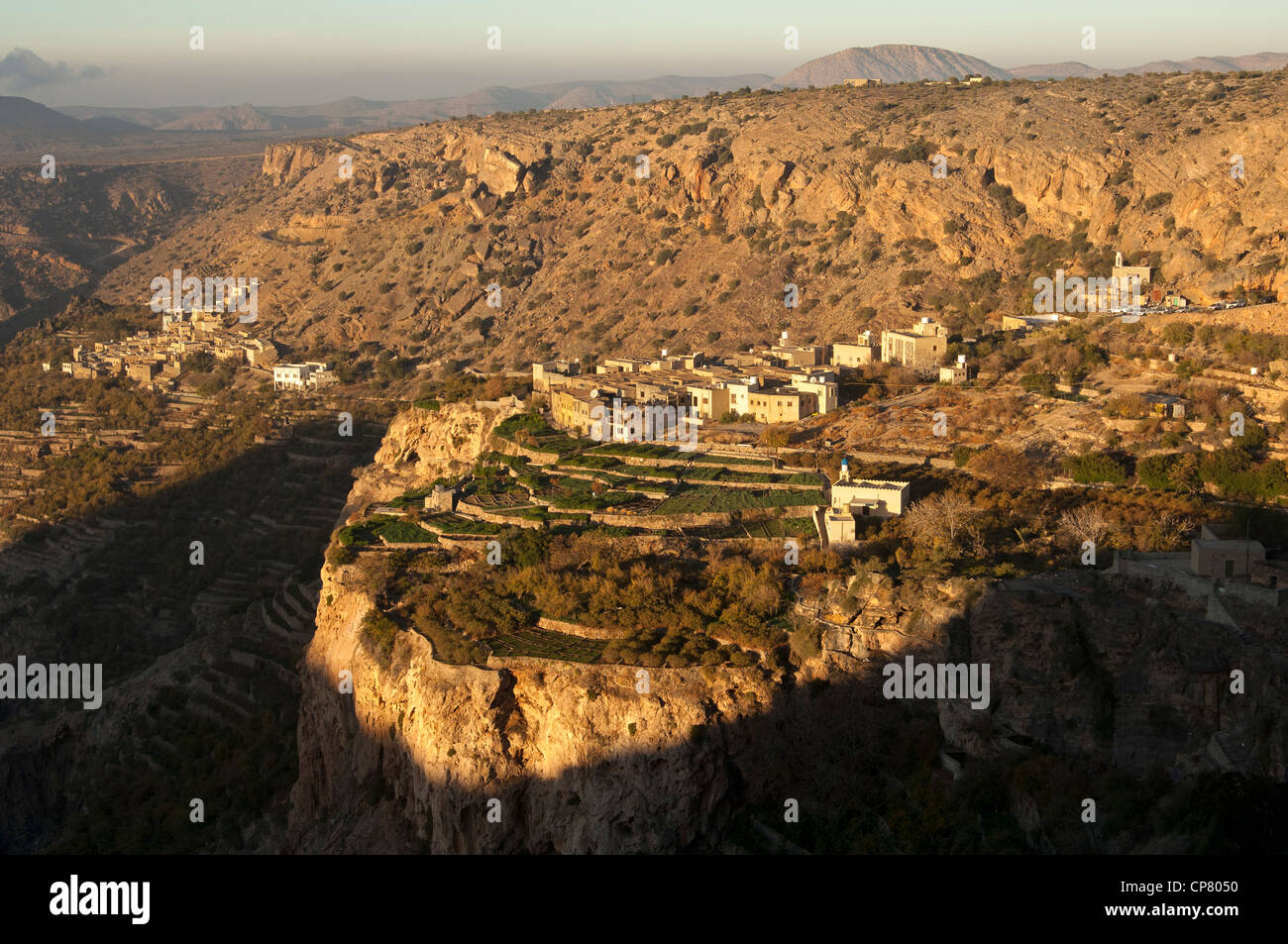 The villages of Ash Sharaijah with its terrace plots and Sayq on the Sayq Plateau in the evening light, Jebel al Alkhdar, Oman Stock Photo