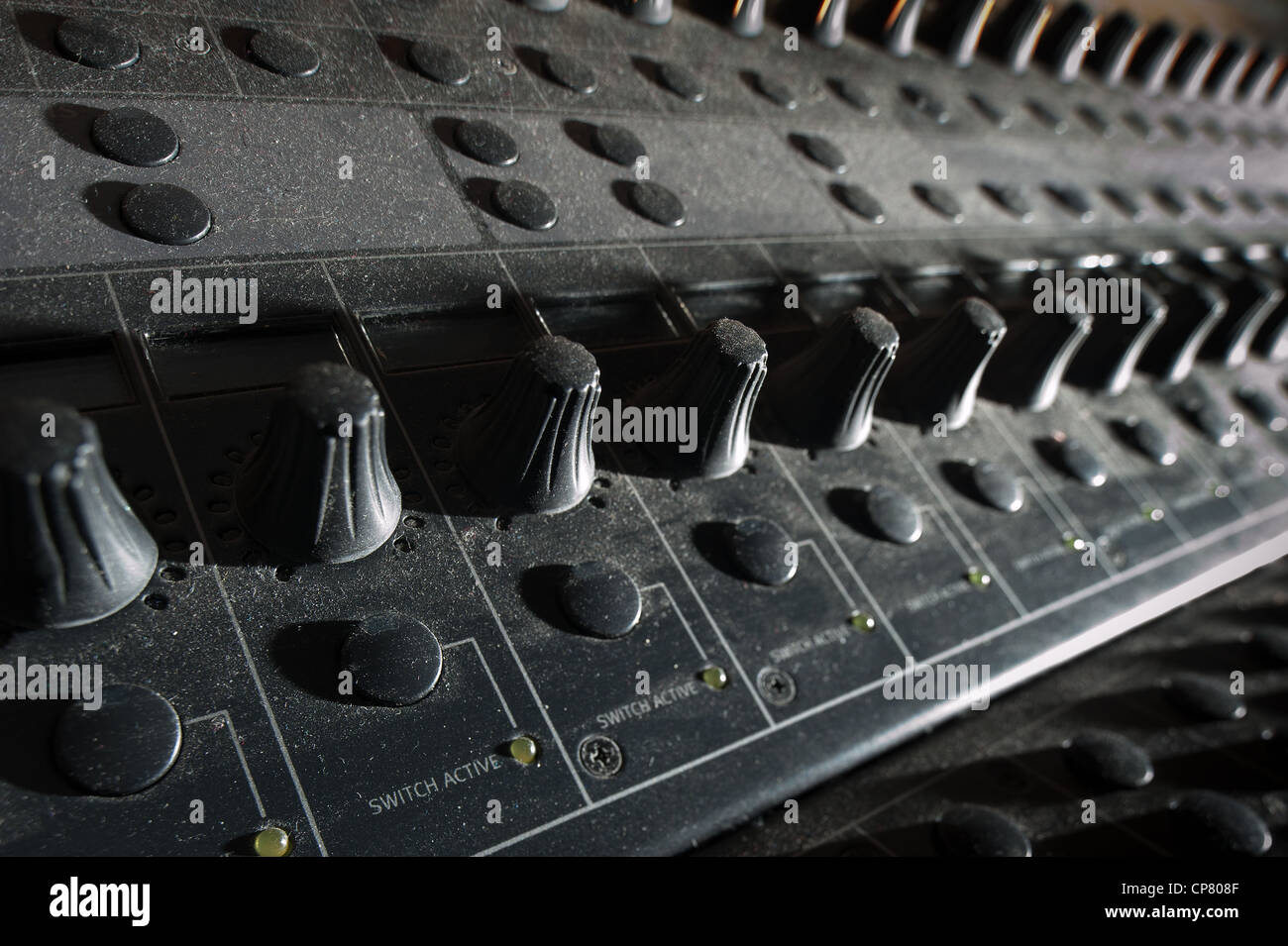 Electronic sound audio mixing desk console in recording studio showing ...