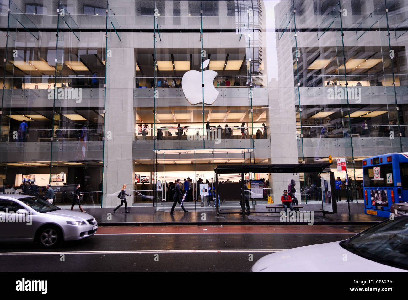 An apple complex in the city with many busy shoppers Stock Photo