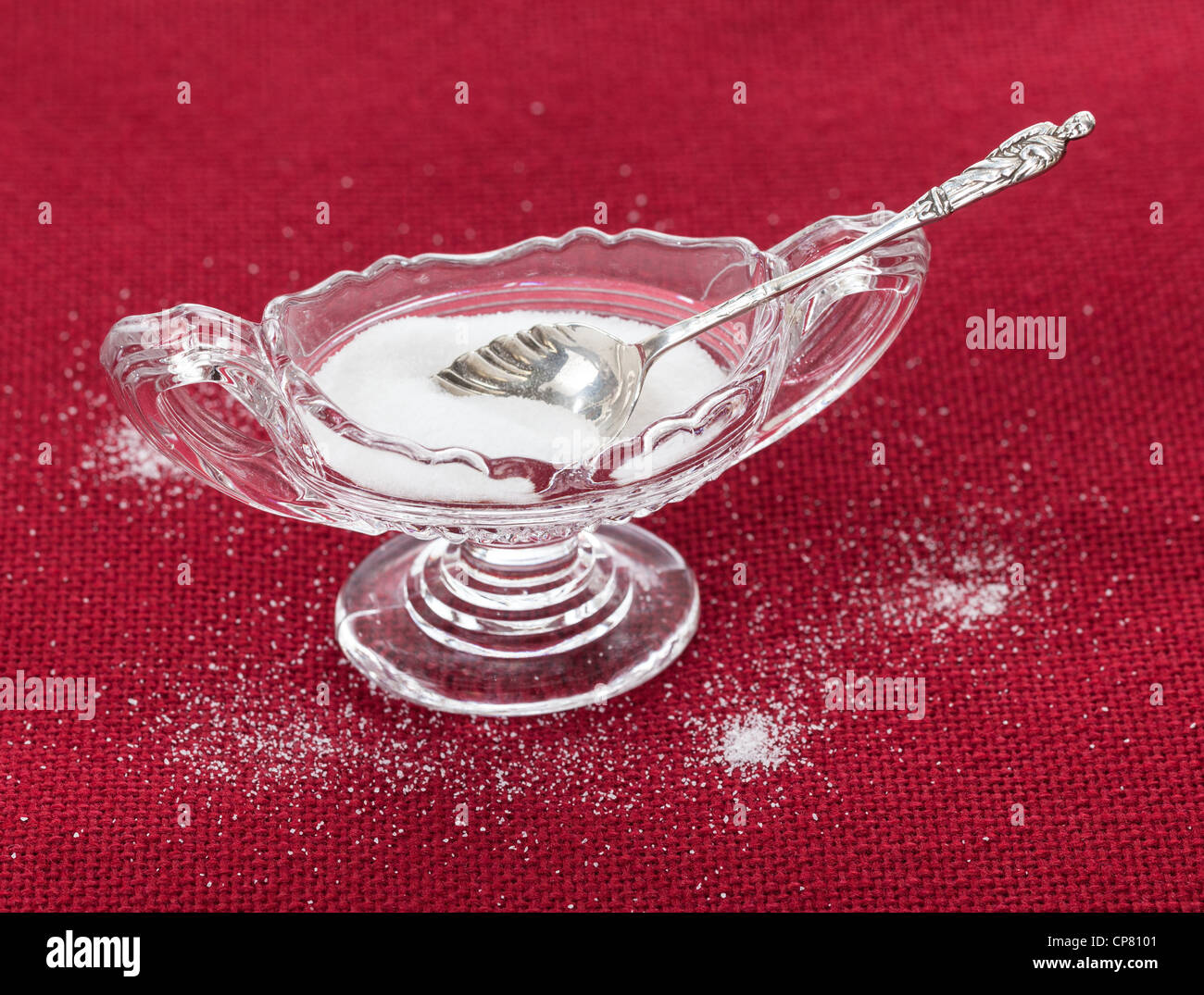 Table salt crystals in cut glass bowl on red tablecloth Stock Photo Alamy