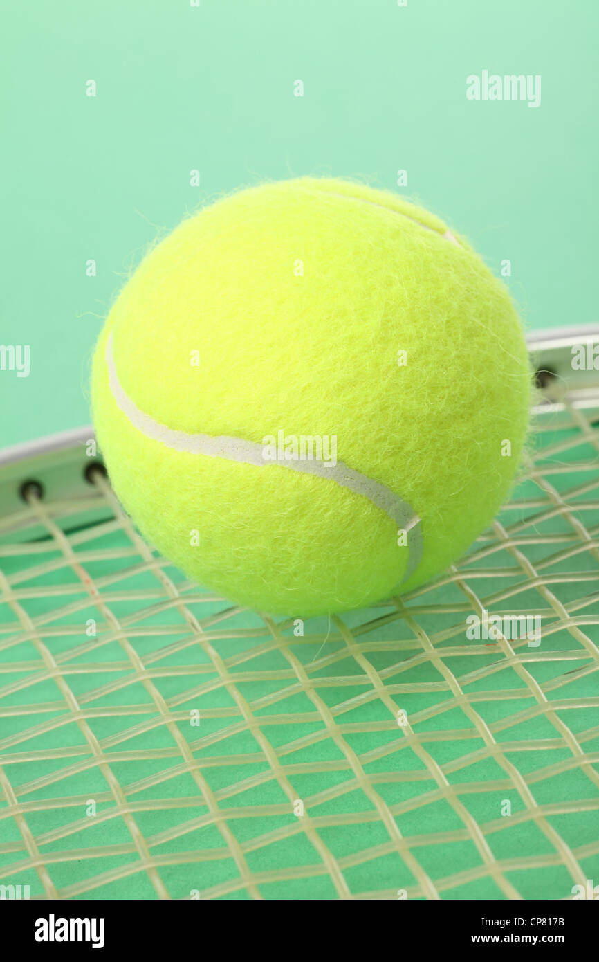 a tennis ball and racket Stock Photo