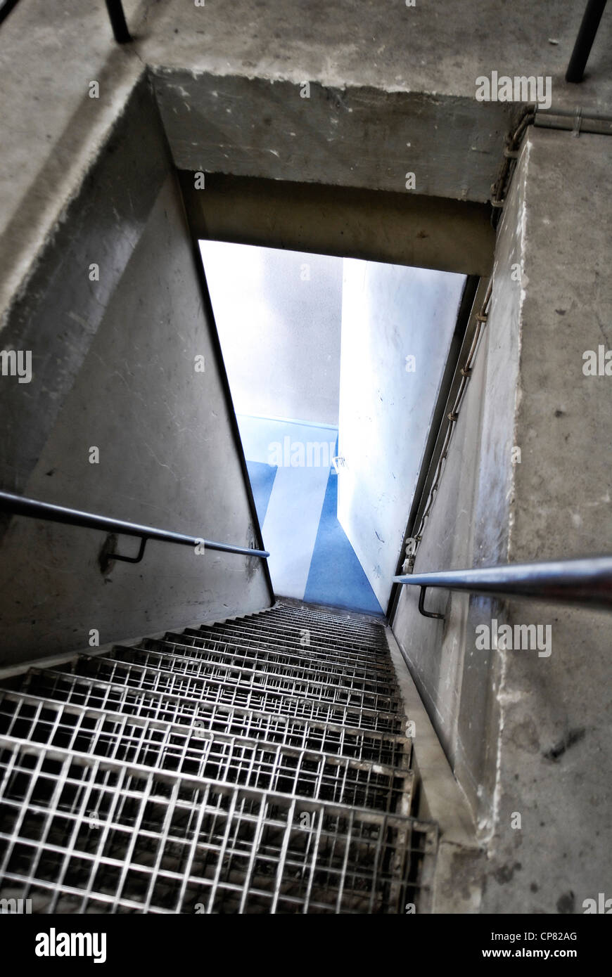 A staircase leads down into a cellar. Stock Photo