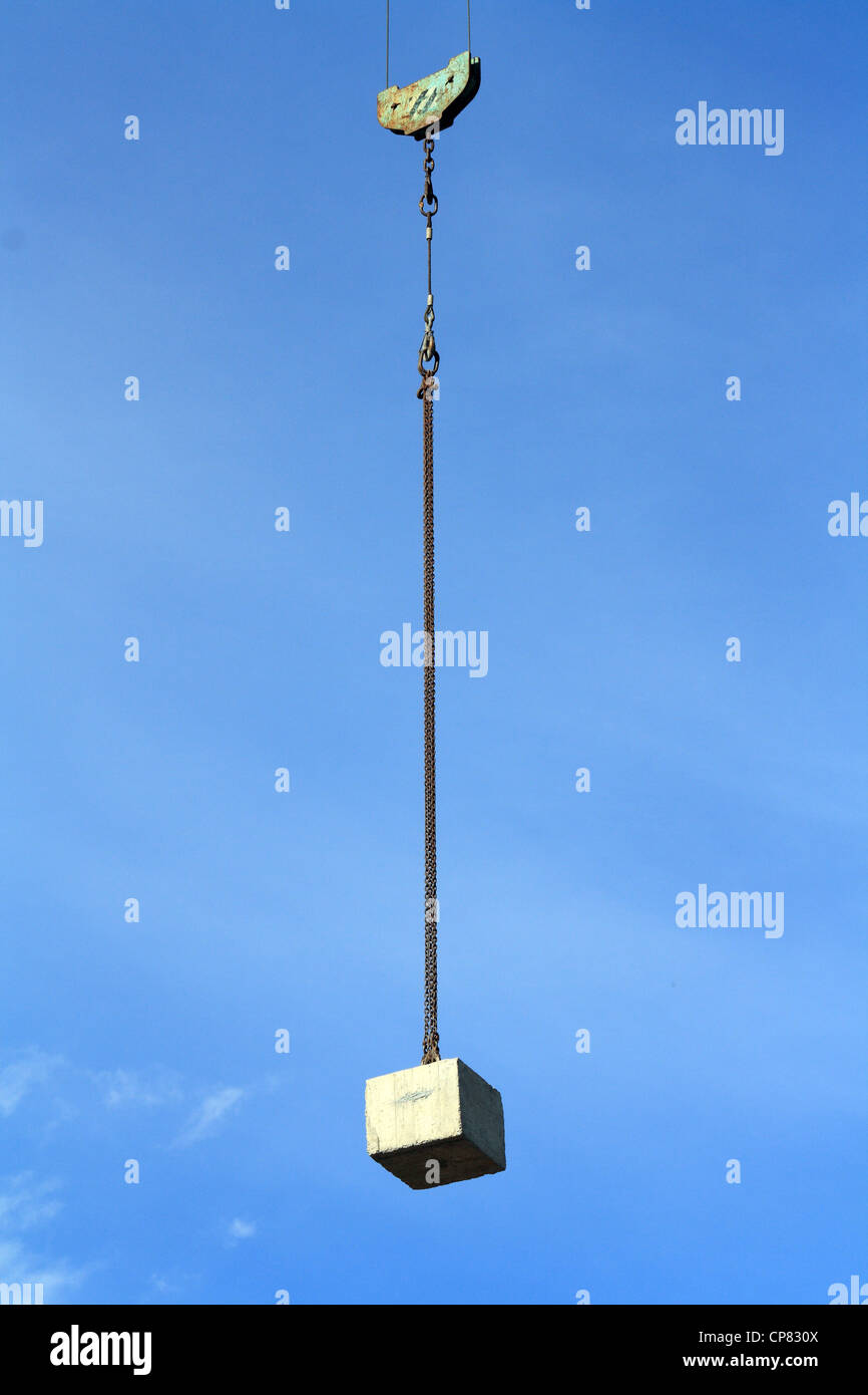 A counterweight suspended with a chain in the air Stock Photo Alamy