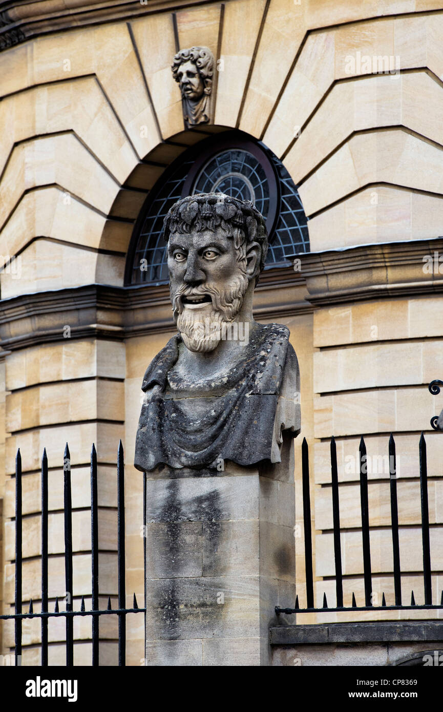 Carved stone bust on a plinth outside Sheldonian theatre, Oxford, Oxfordshire, England Stock Photo