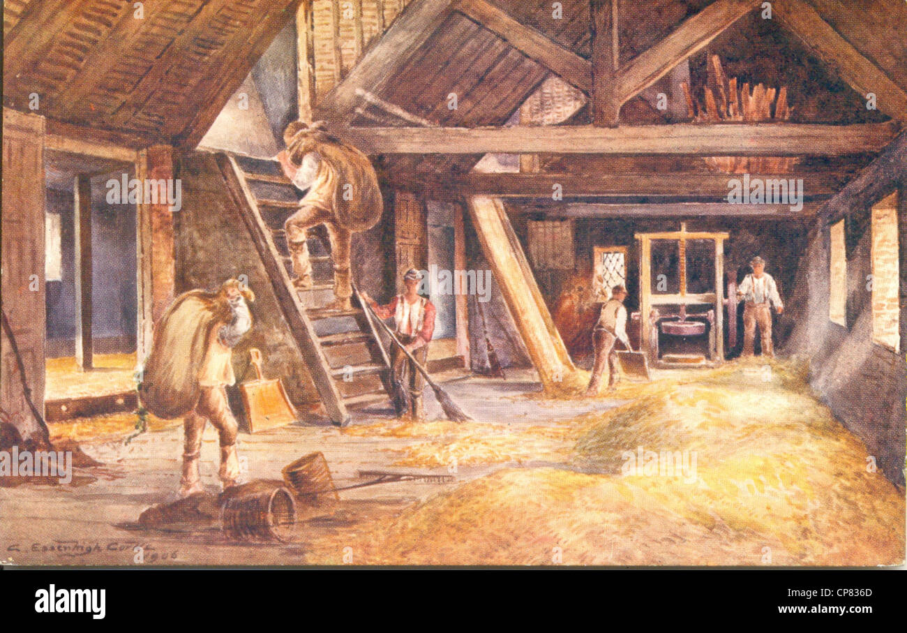 Postcard by artist C Essenhigh Corke  Oast House interior, drying and pocketing hops Stock Photo
