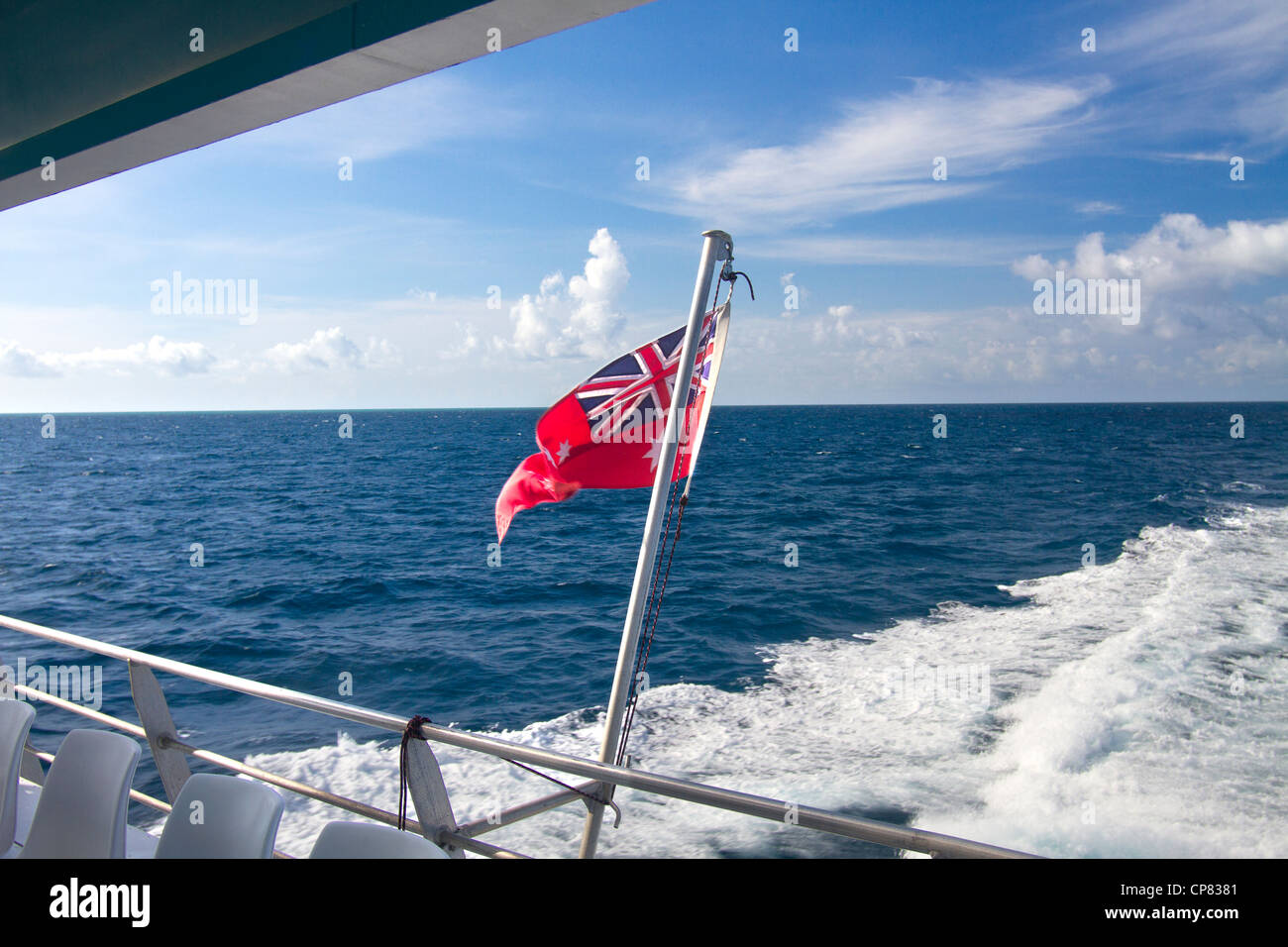Australian flag flying at stern of a tourist boat, Great Barrier Reef