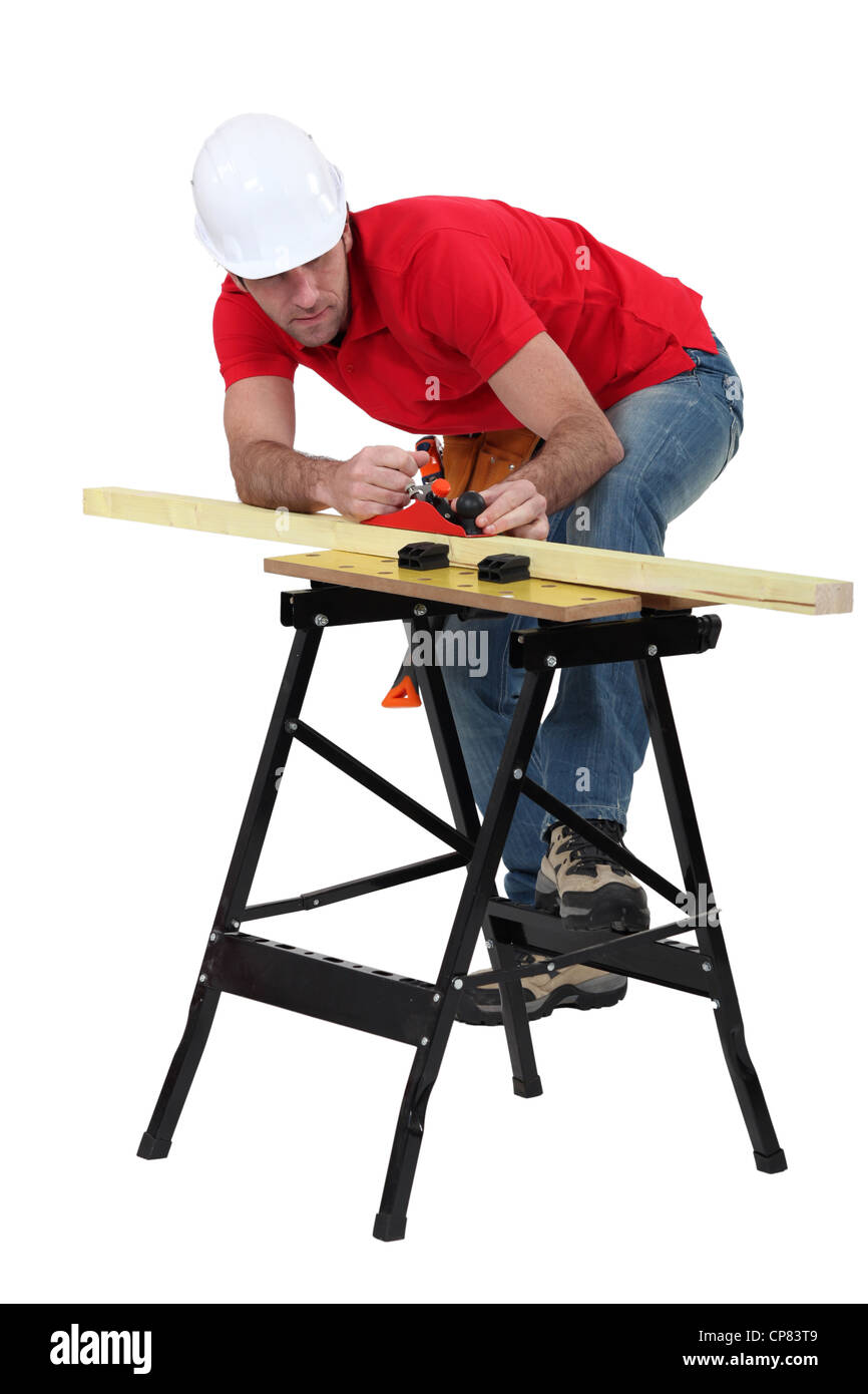 Man planning plank of wood Stock Photo