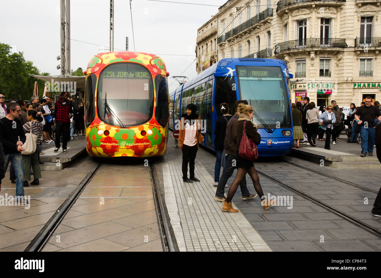 Two modern trams - streetcars - in the main square of Montpellier, southern France Stock Photo