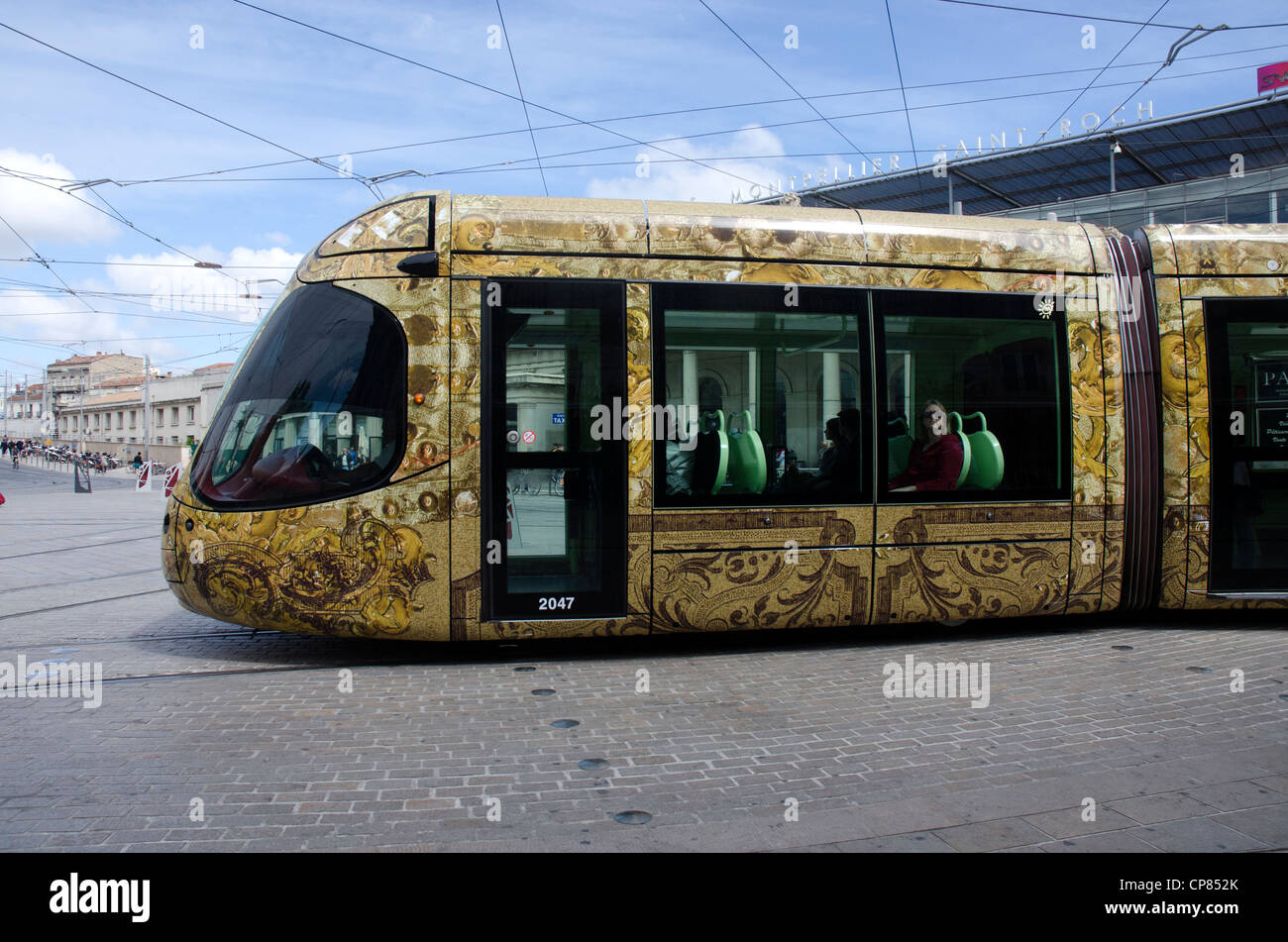 France.  New tram on Line 4 passes Montpellier train station. Stock Photo