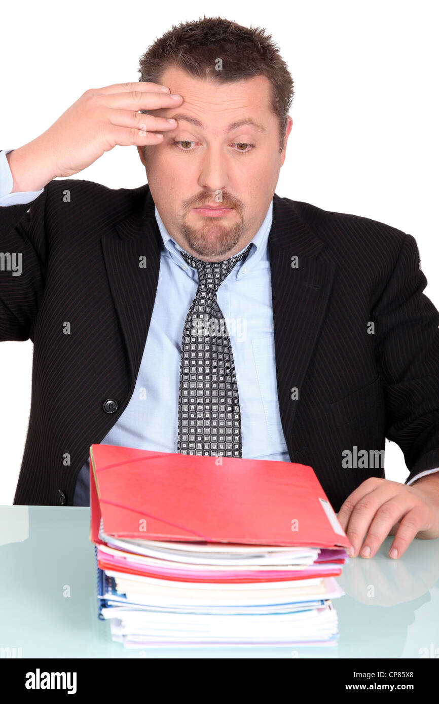 Businessman looking stack folders hi-res stock photography and images ...