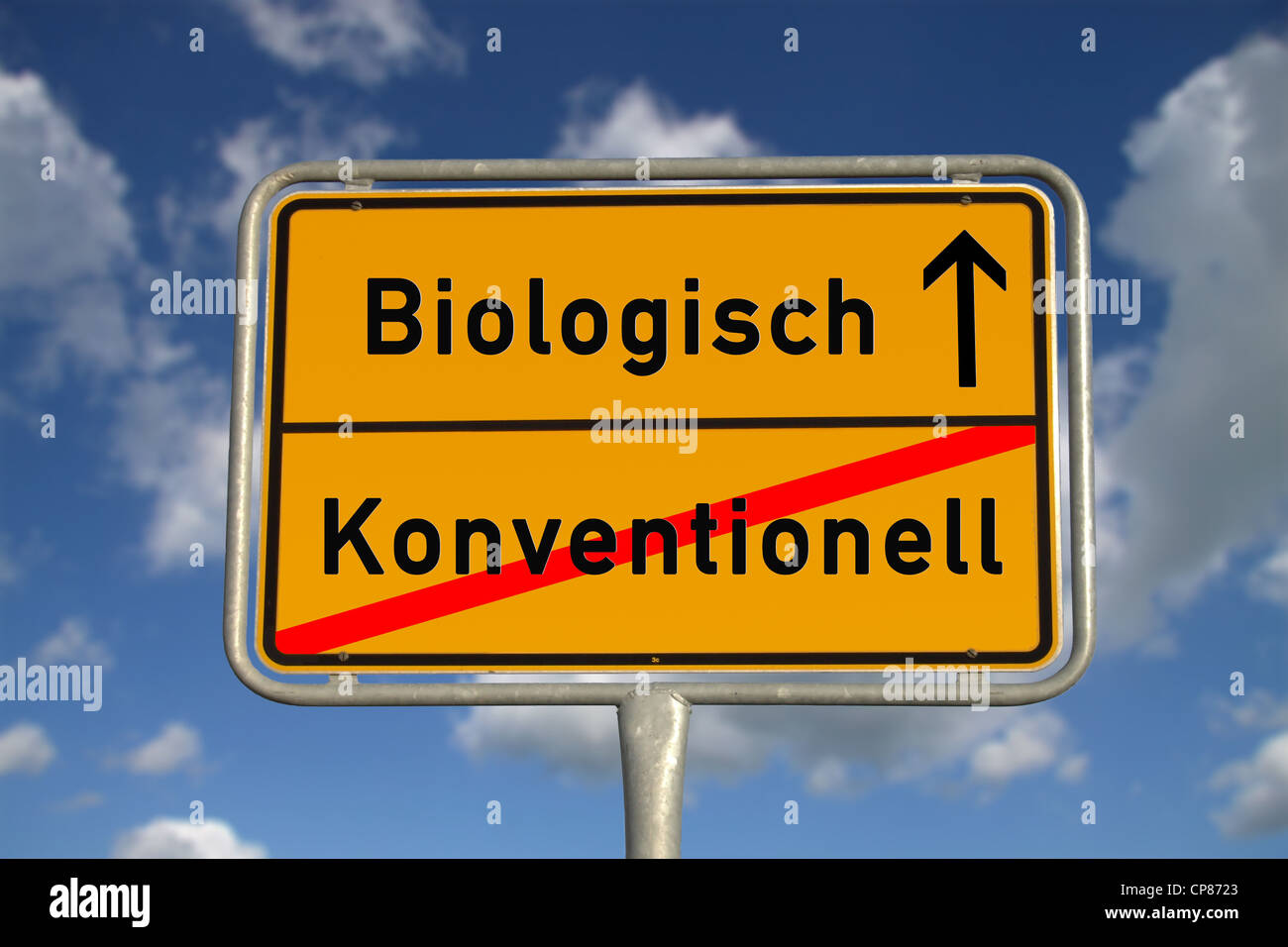 German road sign organic conventional foods with blue sky and white clouds Stock Photo