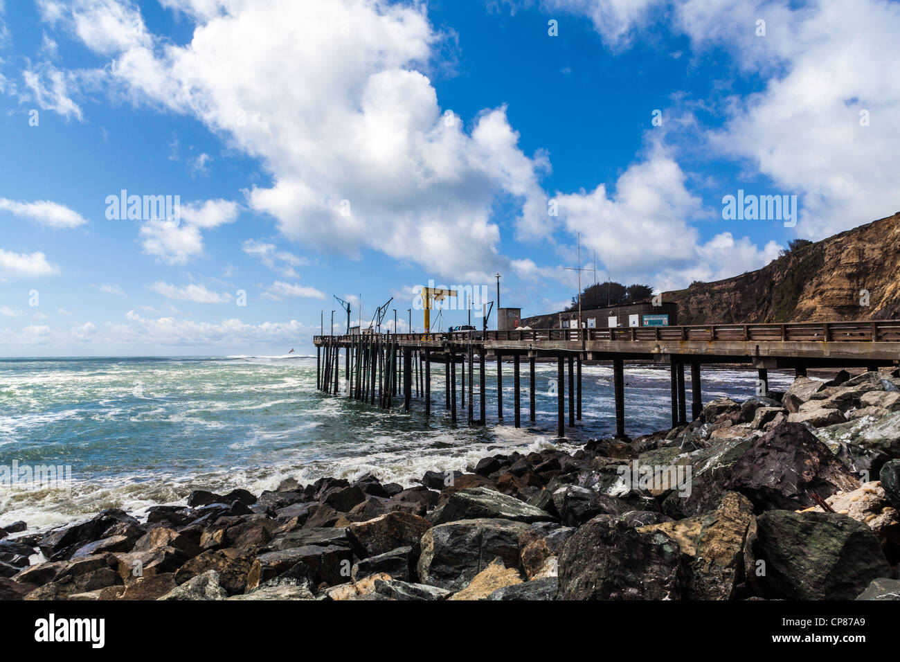 The Pier at Point Arena California with nice puffy cumulus clouds and ...