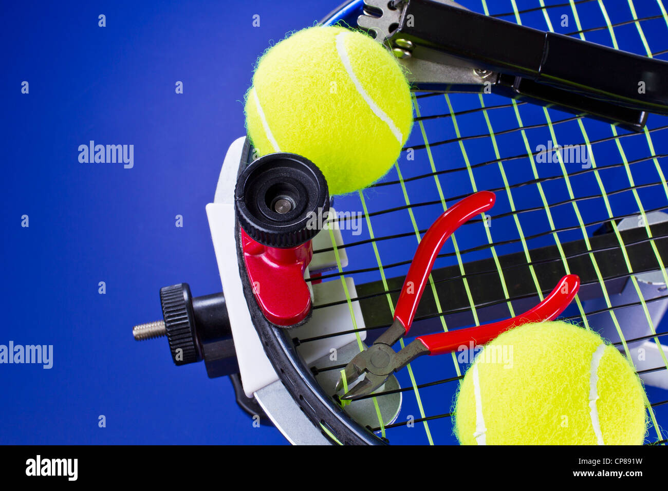 manual stringing of a badminton racket in service Stock Photo - Alamy