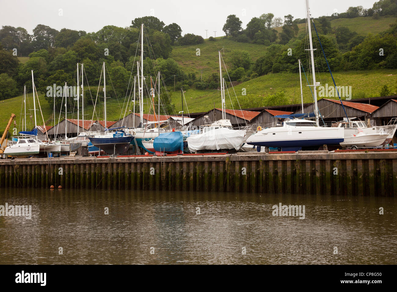 Boat storage and repair yards on the River Dart at Totnes, Devon, UK. Stock Photo