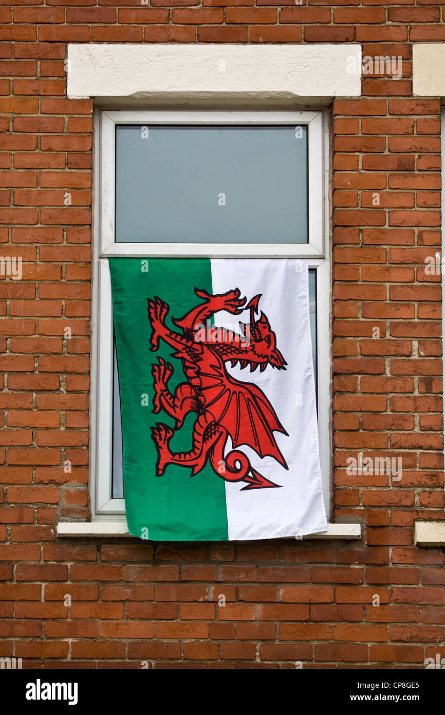 Welsh Flag Hanging from Window on International Match Day Stock Photo