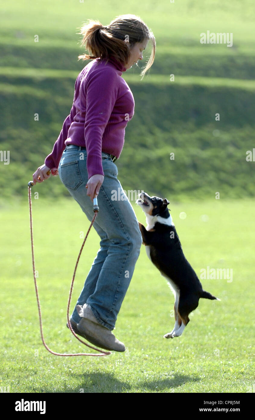 Ami The Jack Russell Cross Enjoys Some Skipping With Her Owner Holly King From Brighton Stock Photo Alamy