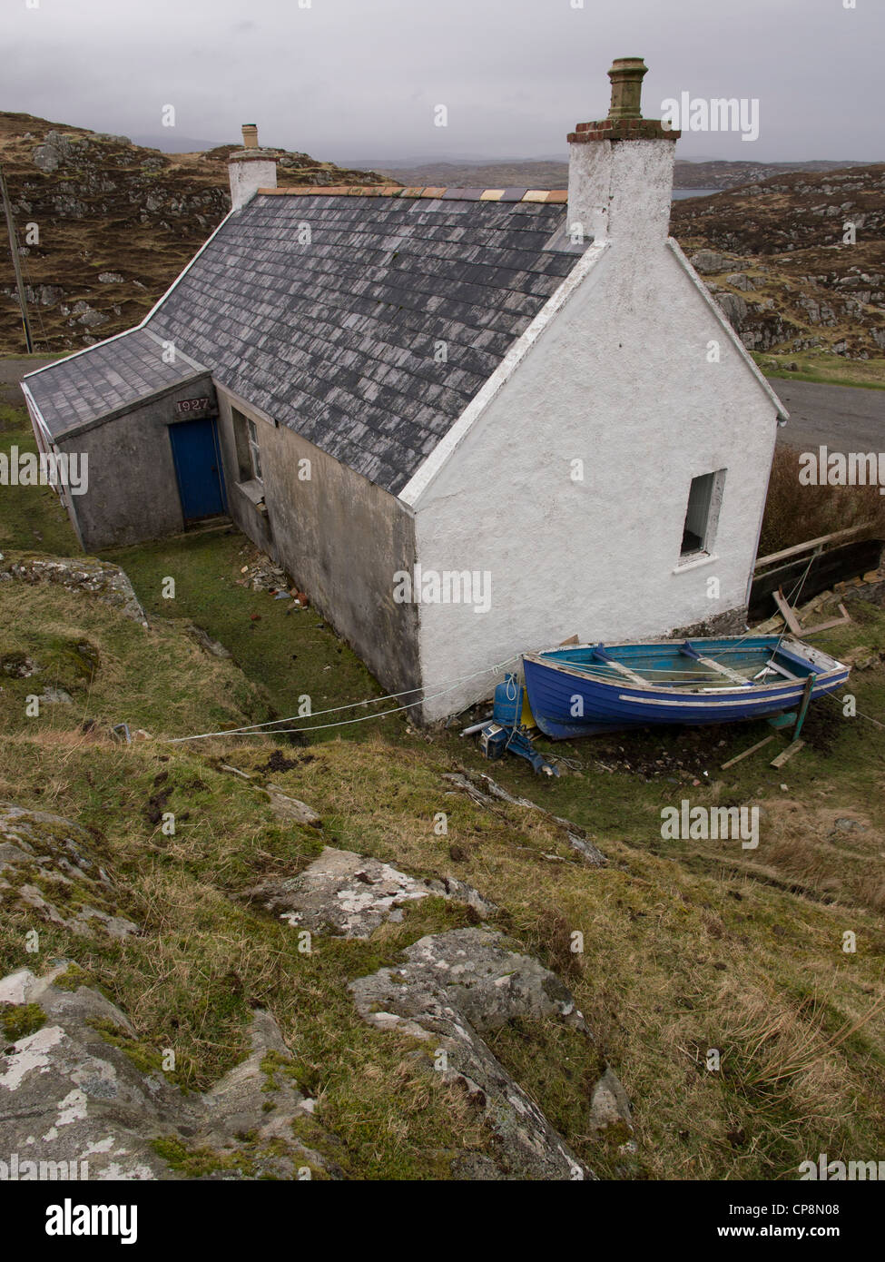 House with Blue Boat, Isle of Harris, Scotland Stock Photo