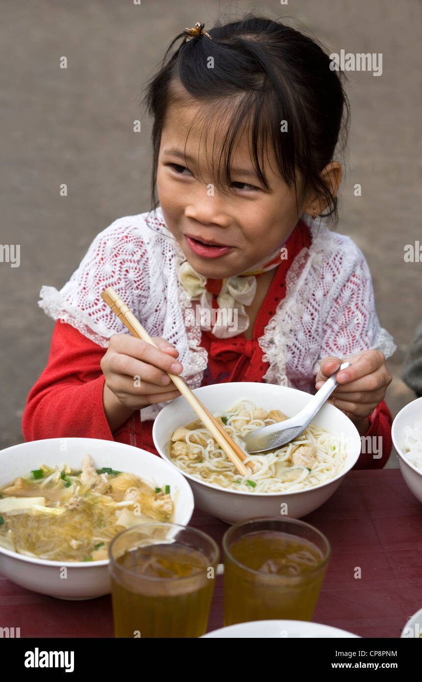 Young girl eating bowl noodles hires stock photography and images Alamy