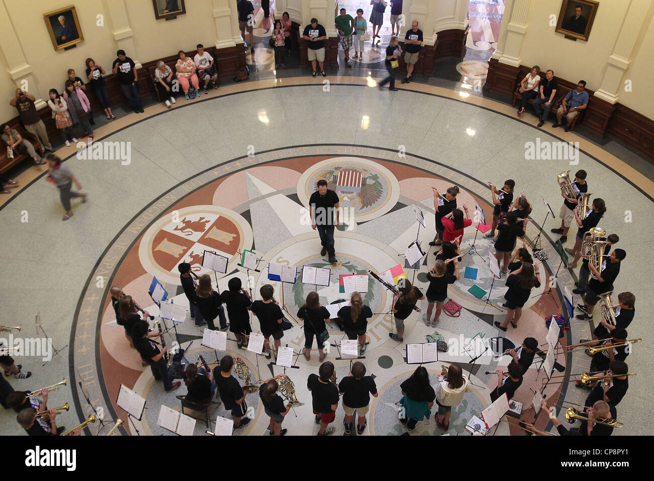 Looking down at a band performing on the entrance level of the Texas State Capitol rotunda. Stock Photo