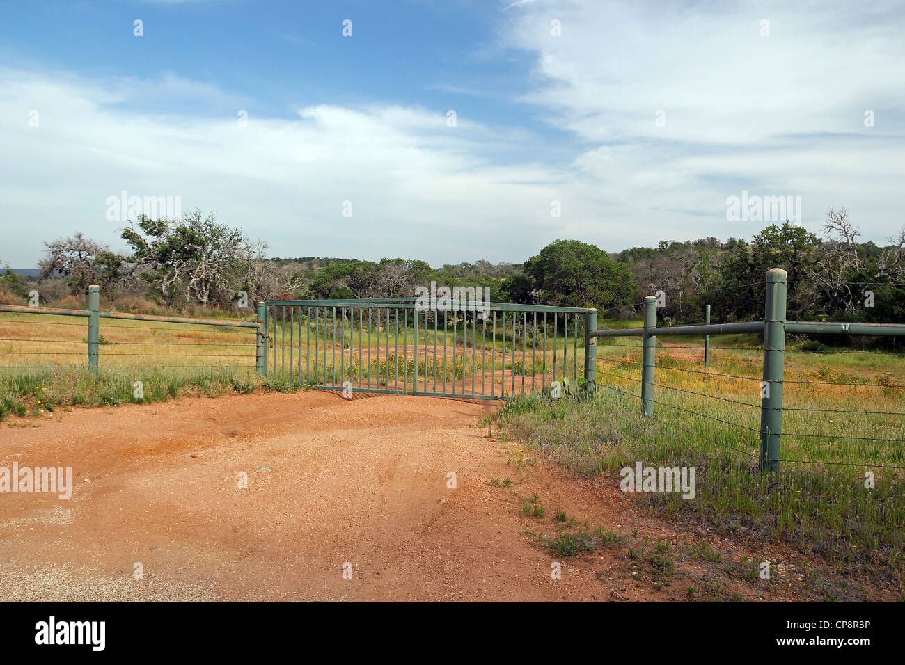 Gate enclosing property beside Willow City Loop scenic drive, near Fredericksburg, Texas, United States Stock Photo