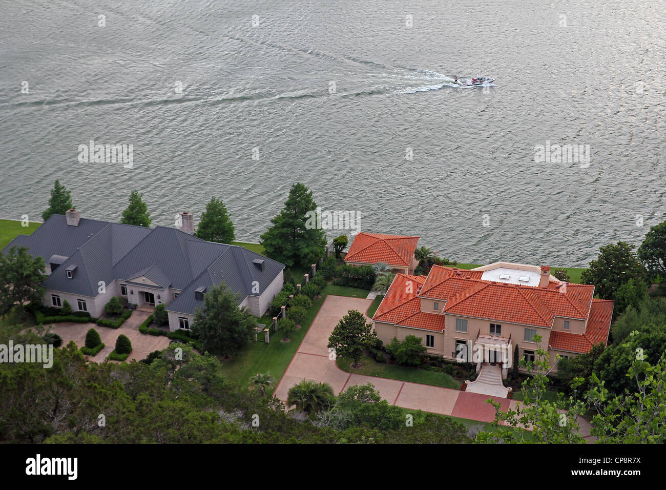 A boat and mansions on the Colorado River, viewed from above. Stock Photo