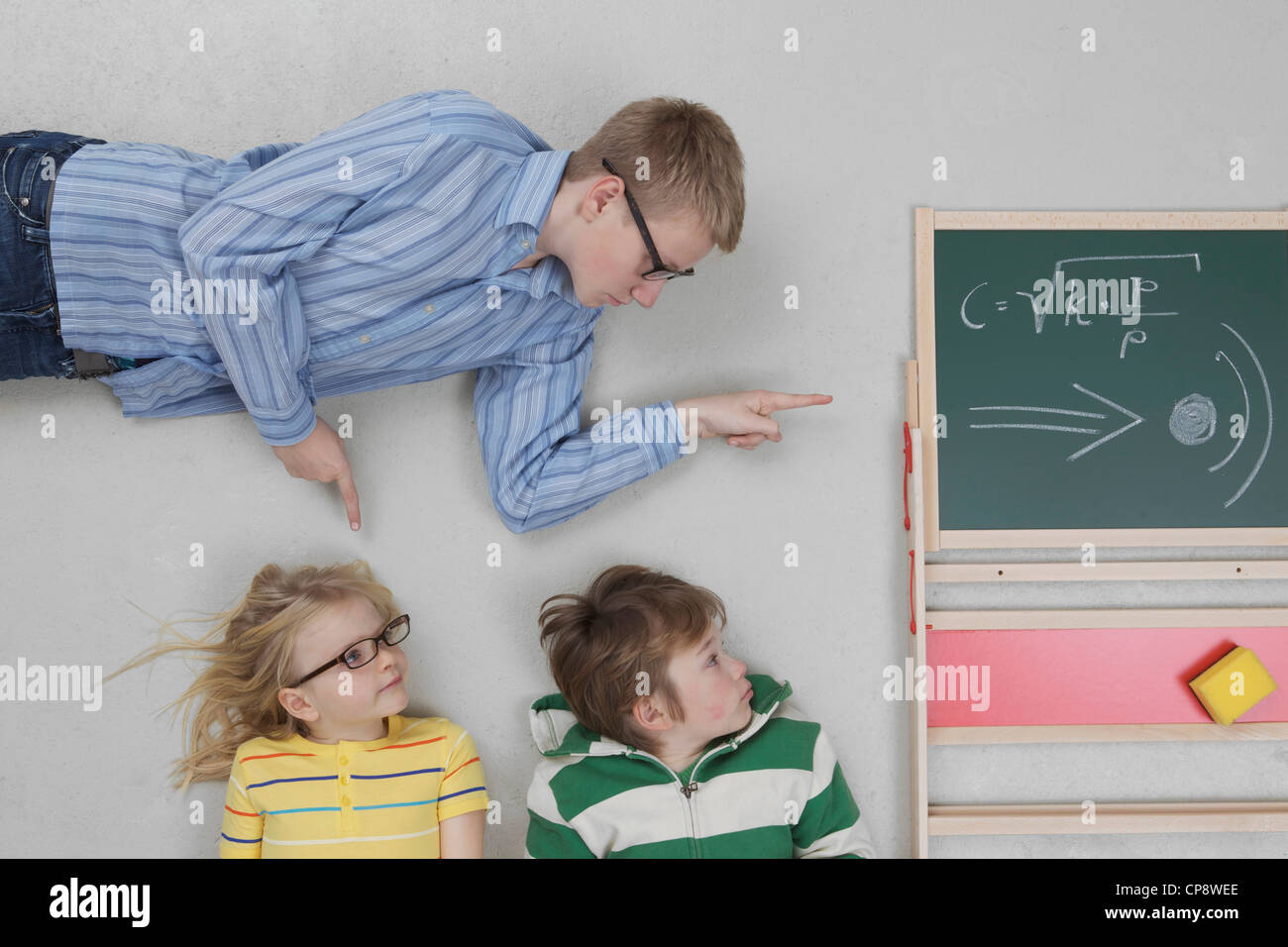 Boy teaching speed of sound to children Stock Photo Alamy