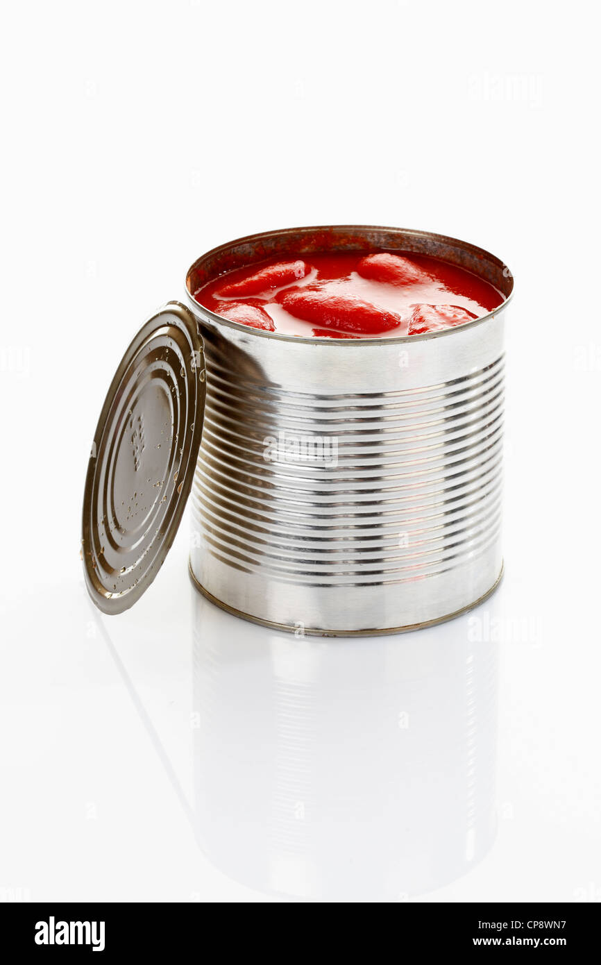 Peeled tomato in tin can on white background Stock Photo Alamy