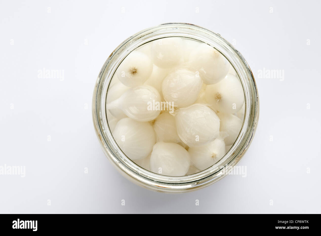 Silverskin onions in glass jar on white background Stock Photo Alamy