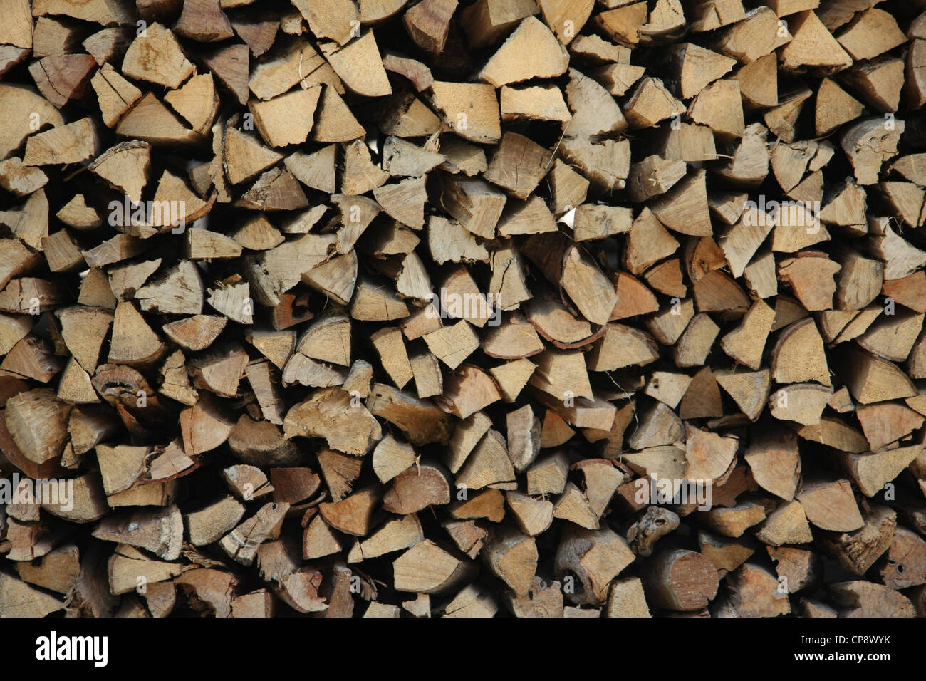 Firewood stacked in aesthetically pleasing pattern Stock Photo