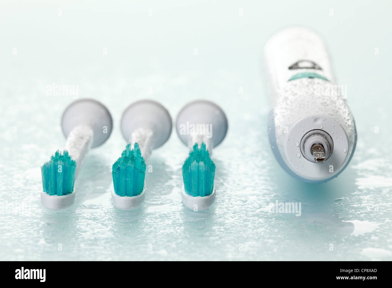 Electric toothbrushes on white background Stock Photo - Alamy