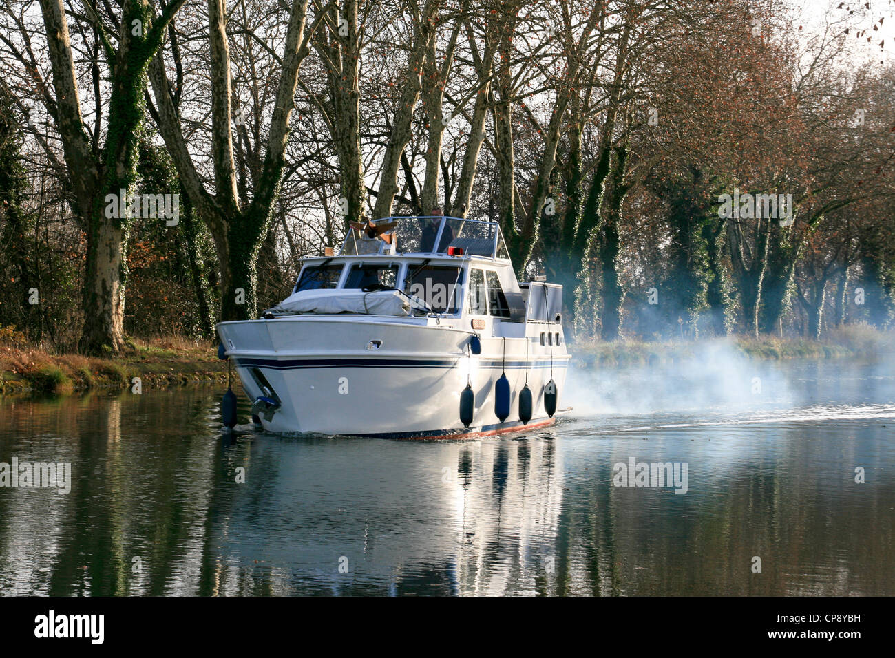Aft cabin motor cruiser on the canal de Deux Mers Stock Photo