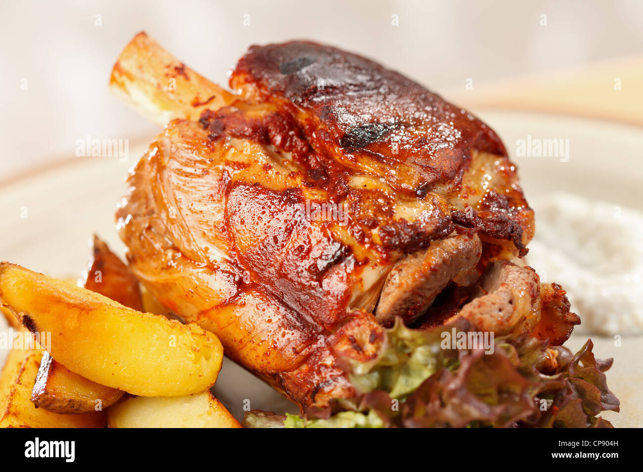 roasted pork knuckle with potatoes Stock Photo Alamy