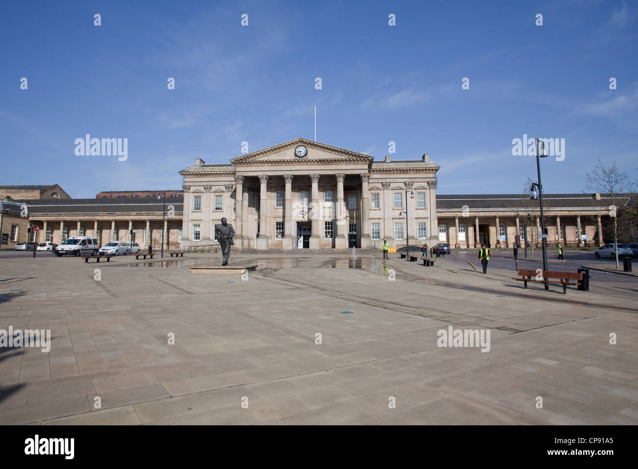 Huddersfield Railway station facade and St George's Square on a summer morning Stock Photo