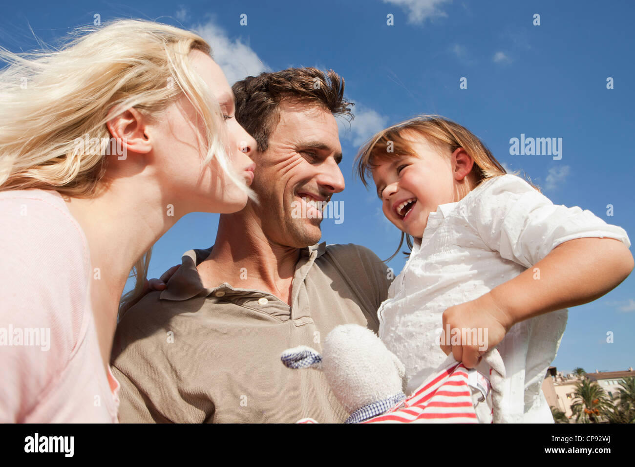 Spain, Mallorca, Palma, Family standing together, smiling Stock Photo