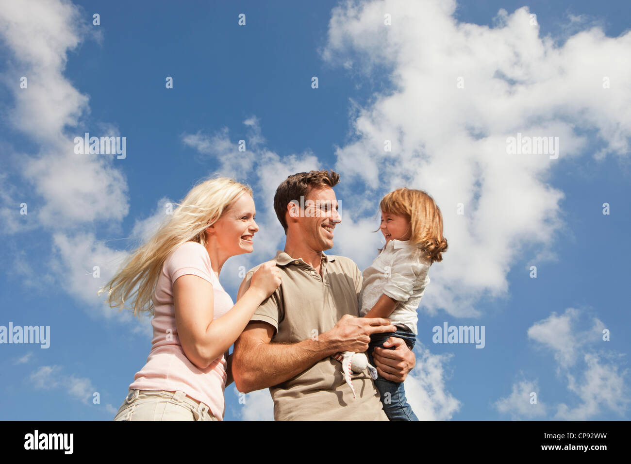 Spain, Mallorca, Palma, Family standing together, smiling Stock Photo