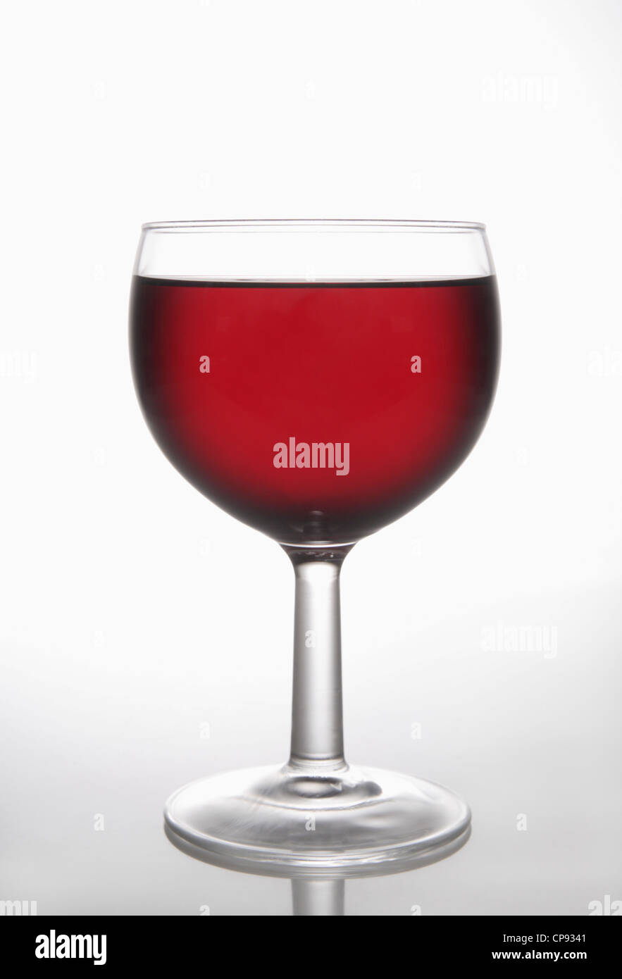 Glass of red wine on white background Stock Photo - Alamy