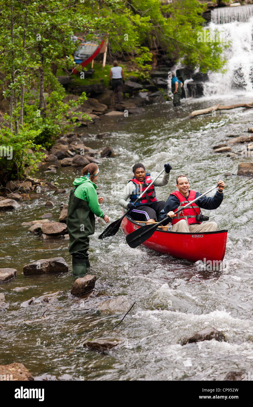 Members of the Bronx River Alliance and supporters canoe down the Bronx