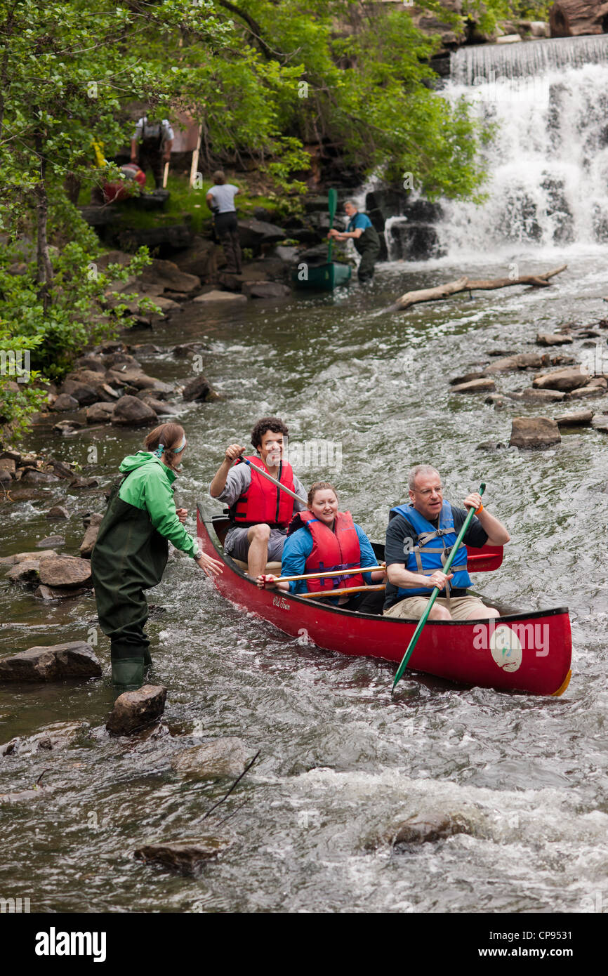 Members of the Bronx River Alliance and supporters canoe down the Bronx ...