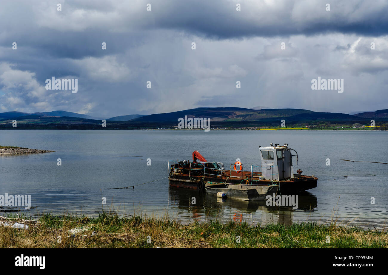 A barge at anchor in the Cromarty Firth Scotland Stock Photo