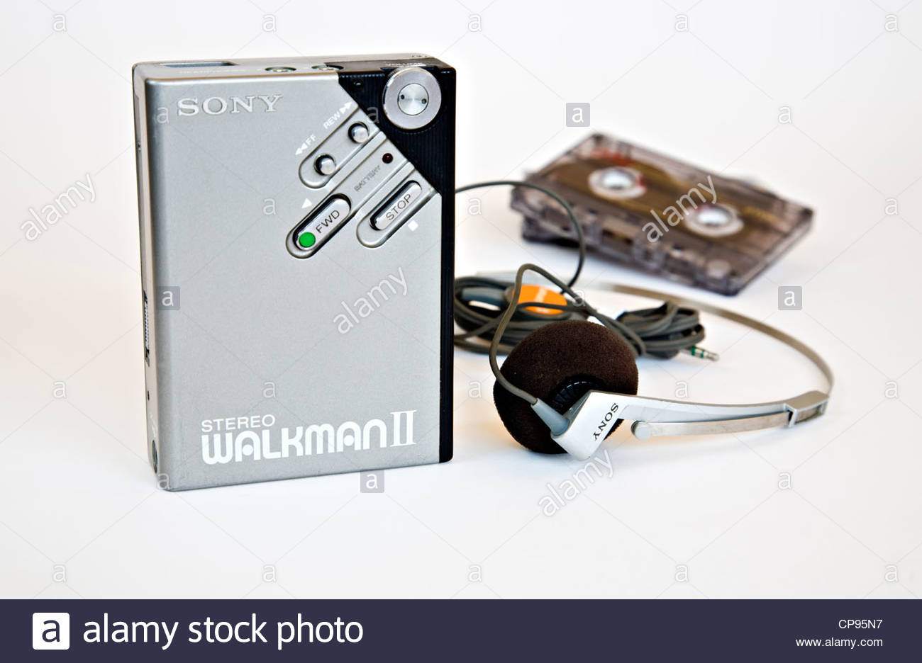 Sony Walkman II with headphones and music cassette on white Stock Photo