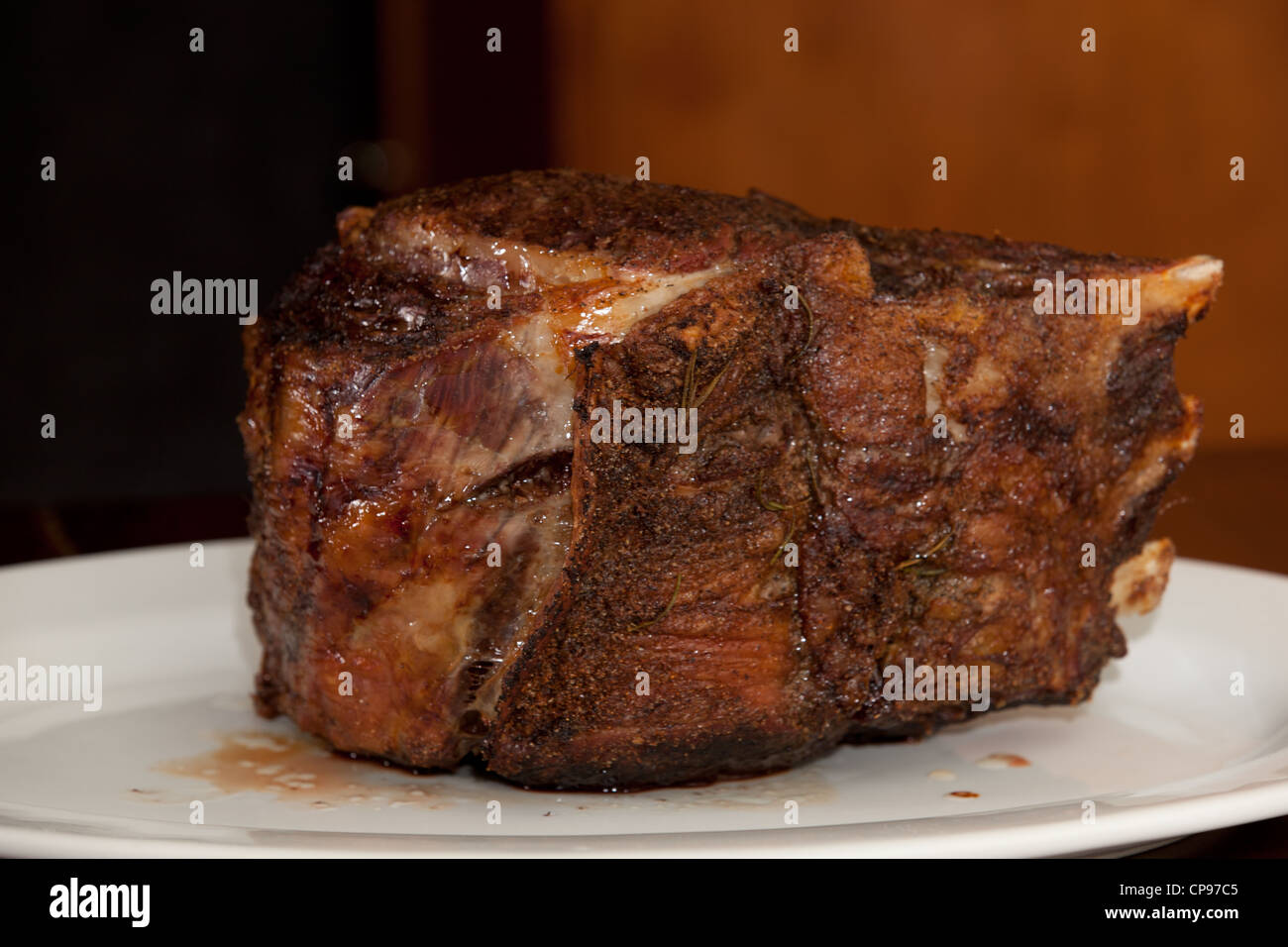 Plate of prime rib roast beef resting after being cooked. Stock Photo