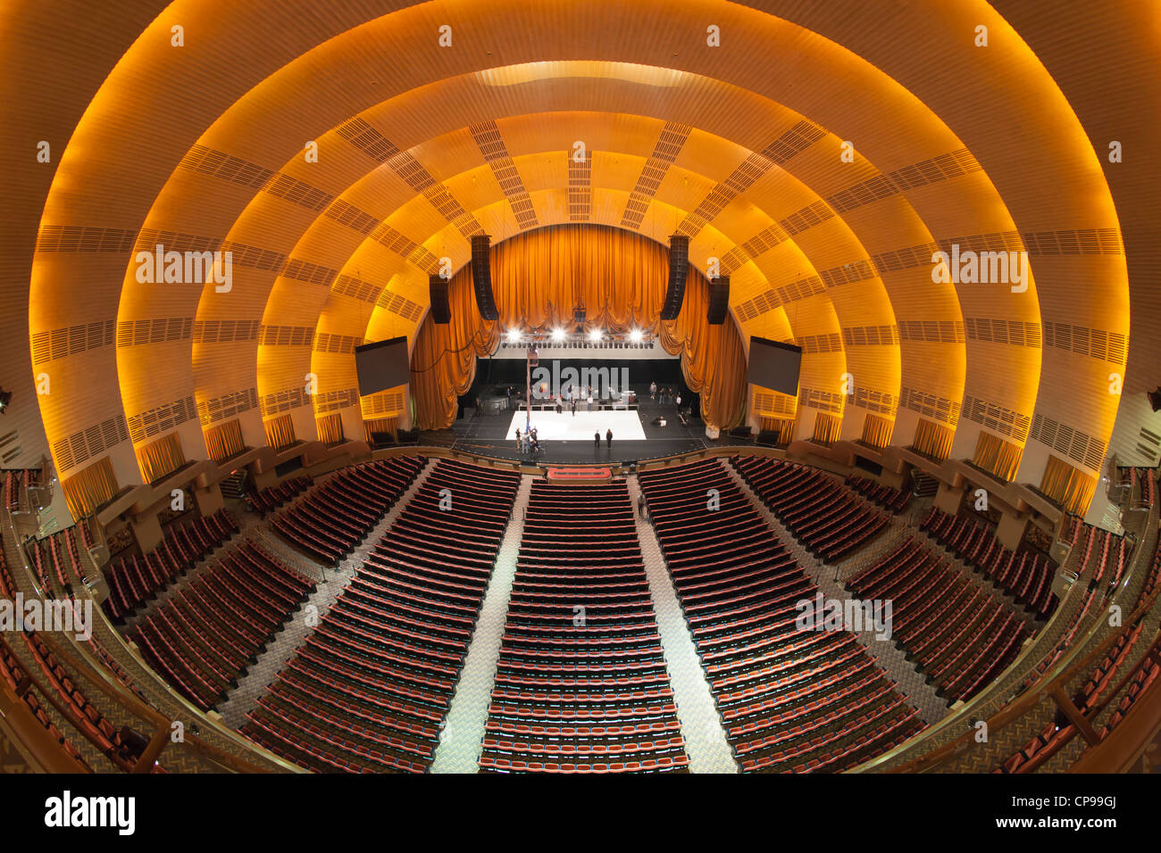 The view of the stage from the balcony as workers prepare for a show in historic Radio City Music Hall in New York City. Stock Photo