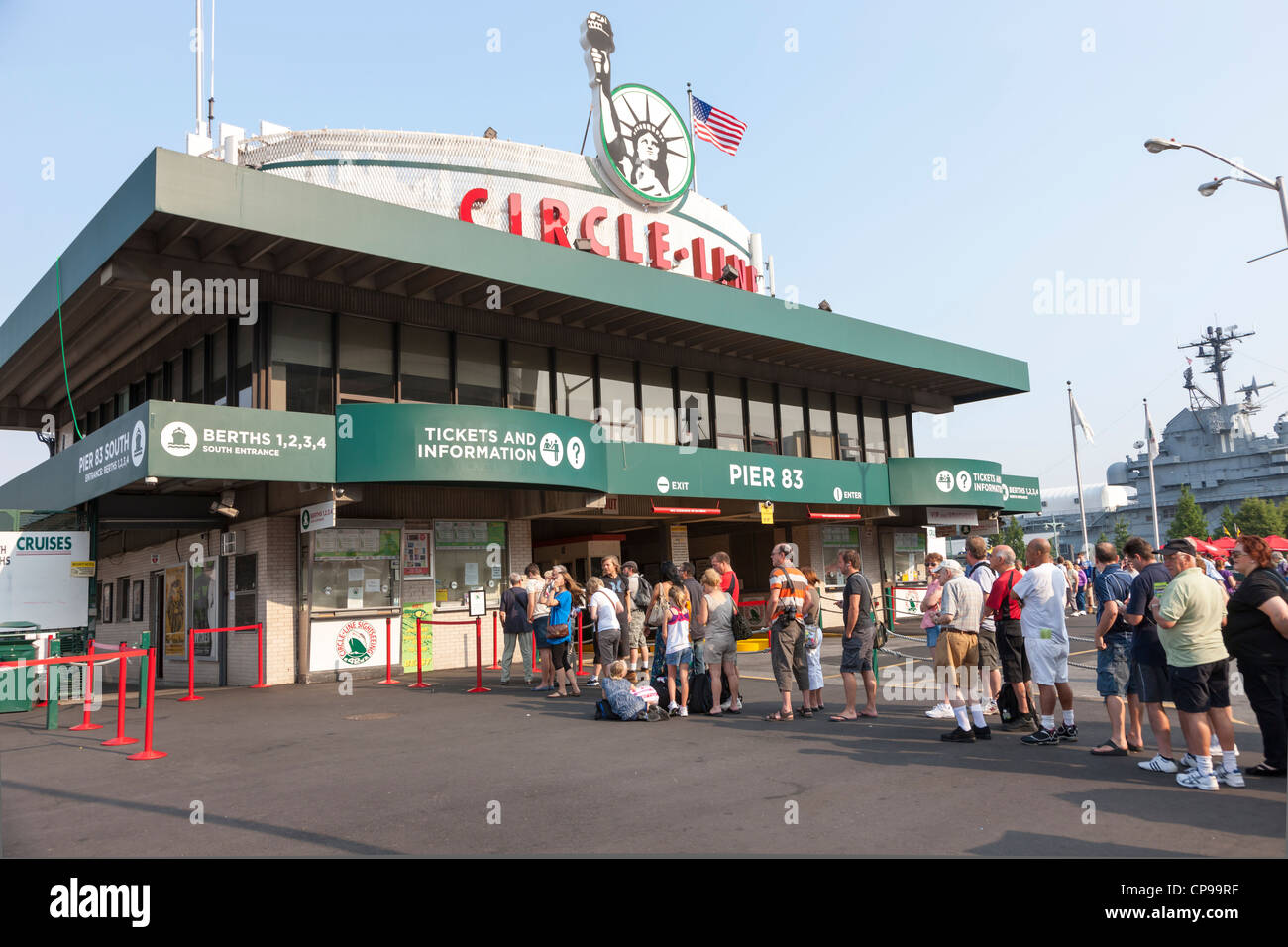 Tourists stand in line to buy tickets at the Circle Line sightseeing cruise building on Pier 83 in New York City. Stock Photo