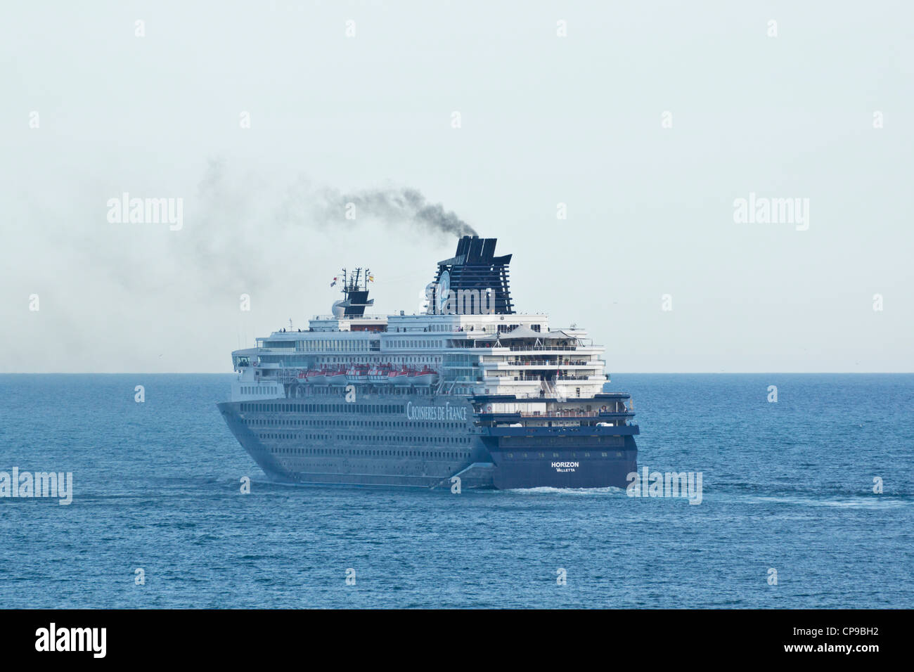 Barcelona - port. Croisieres de France cruise ship. The ship Horizon registered in Valletta, with dirty emissions from engines. Stock Photo