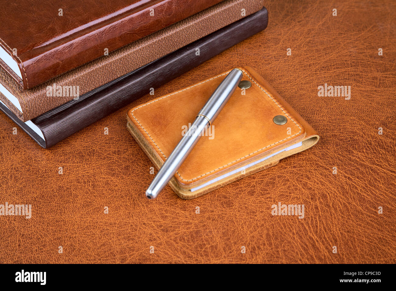 Business still-life with leather organizers and a pen Stock Photo