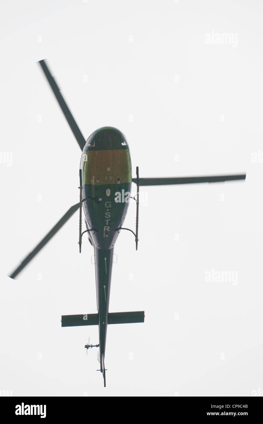 Helicopter in flight Stock Photo